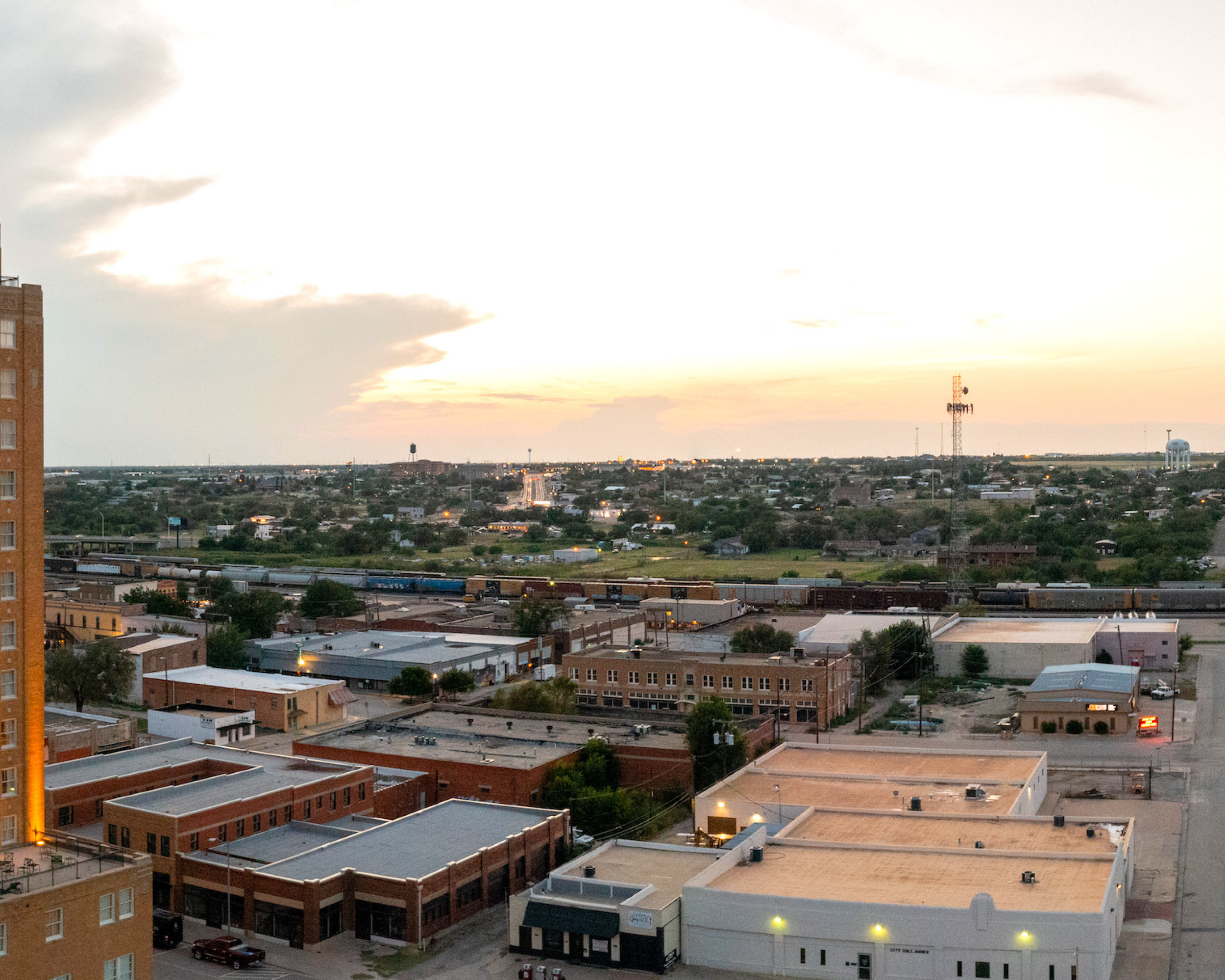 Aerial view of downtown Big Spring with a sun setting